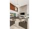 Sunlit open concept living area with fireplace, soaring ceilings and access to the backyard at 34 Olympia Outlook Dr, Las Vegas, NV 89141