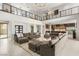 Bright open concept living room featuring modern decor, fireplace and view of the kitchen at 34 Olympia Outlook Dr, Las Vegas, NV 89141
