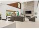 Bright living area with modern finishes, fireplace, and seamless indoor-outdoor flow at 34 Olympia Outlook Dr, Las Vegas, NV 89141