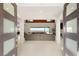 Grand entry to living room boasting neutral colors, tile floors and an expansive view at 34 Olympia Outlook Dr, Las Vegas, NV 89141