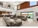 Expansive open floor plan with living area, kitchen and access to an outdoor patio with views at 34 Olympia Outlook Dr, Las Vegas, NV 89141