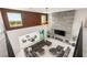 Aerial view of a modern living room featuring a fireplace and views of the patio at 34 Olympia Outlook Dr, Las Vegas, NV 89141