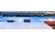 An amazing infinity pool with built-in seating, a fire pit, and panoramic city views creates a luxurious outdoor space at 34 Olympia Outlook Dr, Las Vegas, NV 89141