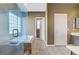 Bathroom featuring a glass-enclosed shower, soaking tub, and tile flooring at 3420 Lockport St, Las Vegas, NV 89129