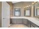 Nicely appointed bathroom with dual sinks, mirrors, and modern lighting fixtures at 3420 Lockport St, Las Vegas, NV 89129