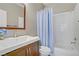 Well-lit bathroom featuring a shower over bath and a single sink vanity at 3420 Lockport St, Las Vegas, NV 89129