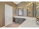 Well-lit bathroom featuring dual sinks and ample counter space at 3420 Lockport St, Las Vegas, NV 89129