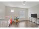Bright bedroom with dark laminate floors and a white crib with matching furniture at 3420 Lockport St, Las Vegas, NV 89129
