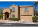 Attractive two-story house with a desert landscape and attached two-car garage at 3420 Lockport St, Las Vegas, NV 89129