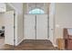 Welcoming foyer featuring double doors, hardwood floors, and an open view to the office at 3420 Lockport St, Las Vegas, NV 89129