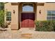 Inviting home entrance features double doors, well-maintained landscaping, and decorative stone steps at 3420 Lockport St, Las Vegas, NV 89129