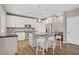 Modern kitchen with white cabinets, stainless steel appliances, and a center island with seating at 3420 Lockport St, Las Vegas, NV 89129