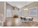 Inviting living area featuring hardwood floors, and large windows, for a warm and bright space at 3420 Lockport St, Las Vegas, NV 89129
