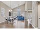 Spacious living room boasts vaulted ceilings, wood floors, and modern decor with ample natural light at 3420 Lockport St, Las Vegas, NV 89129