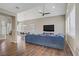 Inviting living room with vaulted ceilings, hardwood floors, and a modern ceiling fan at 3420 Lockport St, Las Vegas, NV 89129
