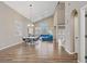 Bright, open floor plan living room featuring high ceilings, hardwood floors, and modern furnishings at 3420 Lockport St, Las Vegas, NV 89129