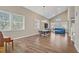 Open-concept living area with hardwood floors, vaulted ceilings, and large windows for abundant light at 3420 Lockport St, Las Vegas, NV 89129