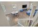 Bright living room features wood floors, dining table, and cozy blue seating at 3420 Lockport St, Las Vegas, NV 89129
