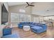 Bright living room featuring hardwood floors, large windows, and comfortable sectional sofa at 3420 Lockport St, Las Vegas, NV 89129