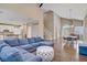 Open-concept living area boasts hardwood floors, vaulted ceilings, and seamless flow to kitchen and dining at 3420 Lockport St, Las Vegas, NV 89129