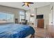 Cozy main bedroom with wood floors, multiple windows, and ensuite bath at 3420 Lockport St, Las Vegas, NV 89129
