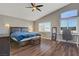 Spacious main bedroom with vaulted ceiling, large windows, and stylish decor at 3420 Lockport St, Las Vegas, NV 89129