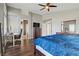 Bright main bedroom with wood floors, desk, and an ensuite bathroom at 3420 Lockport St, Las Vegas, NV 89129