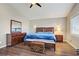 Comfortable main bedroom with wood floors, dresser, and abundant natural light at 3420 Lockport St, Las Vegas, NV 89129