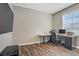 Functional home office featuring hardwood floors, neutral walls, and large sunny window at 3420 Lockport St, Las Vegas, NV 89129