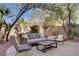 Outdoor patio with comfortable seating and lush landscaping, perfect for relaxation at 3420 Lockport St, Las Vegas, NV 89129