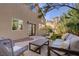 Comfortable patio area with nice outdoor seating, garden and a view of the exterior of the house at 3420 Lockport St, Las Vegas, NV 89129