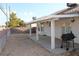 View of the backyard with a covered patio and grill at 3524 Silver Lantern Dr, North Las Vegas, NV 89032