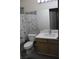 Modern bathroom featuring tile floors, a new vanity with marble top, and updated fixtures at 3524 Silver Lantern Dr, North Las Vegas, NV 89032