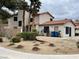 Two-story home with desert landscaping, tile roof, and neutral colored stucco exterior at 3821 Dream St, Las Vegas, NV 89108