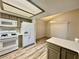 Clean kitchen with modern appliances and a breakfast bar overlooking dining area at 3821 Dream St, Las Vegas, NV 89108
