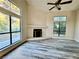Bright living room featuring vaulted ceilings, wood floors and a cozy fireplace at 3821 Dream St, Las Vegas, NV 89108