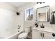 Bright bathroom with a shower-tub combo, sleek vanity, and modern finishes at 416 Greenbrook St, Las Vegas, NV 89110