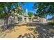Landscaped front yard features desert landscaping, a mature tree, and a brick driveway at 416 Greenbrook St, Las Vegas, NV 89110