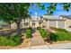 Beautiful two-story home with a lush front yard, walkway, and mature landscaping at 416 Greenbrook St, Las Vegas, NV 89110