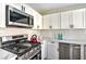 This kitchen features stainless steel appliances, white countertops and white backsplash at 416 Greenbrook St, Las Vegas, NV 89110