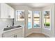 Kitchen sink with a view of the sparkling backyard pool at 416 Greenbrook St, Las Vegas, NV 89110