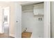 This well-lit laundry room features wood floors, cabinet storage, and washer/dryer hookups at 416 Greenbrook St, Las Vegas, NV 89110