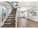 Open floor plan with staircase and wood-look flooring offers a modern feel at 416 Greenbrook St, Las Vegas, NV 89110