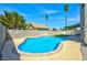 Backyard features a sparkling blue pool and concrete patio space perfect for lounging at 416 Greenbrook St, Las Vegas, NV 89110