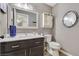 Bathroom featuring a vanity, a mirror, and a decorative cabinet at 421 Raindance Dr, Henderson, NV 89014