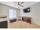 Bedroom features neutral carpet, ceiling fan, and piano at 421 Raindance Dr, Henderson, NV 89014