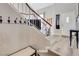 Inviting entryway features a staircase, coat rack, and bench, offering a warm welcome at 421 Raindance Dr, Henderson, NV 89014