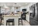 Well-equipped kitchen featuring stainless steel appliances, granite countertops and white cabinets at 421 Raindance Dr, Henderson, NV 89014