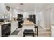 Bright kitchen features white cabinets, granite countertops, stainless steel appliances, and breakfast bar with seating at 421 Raindance Dr, Henderson, NV 89014