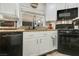 Bright kitchen features white cabinets, granite countertops, and stainless steel appliances at 421 Raindance Dr, Henderson, NV 89014